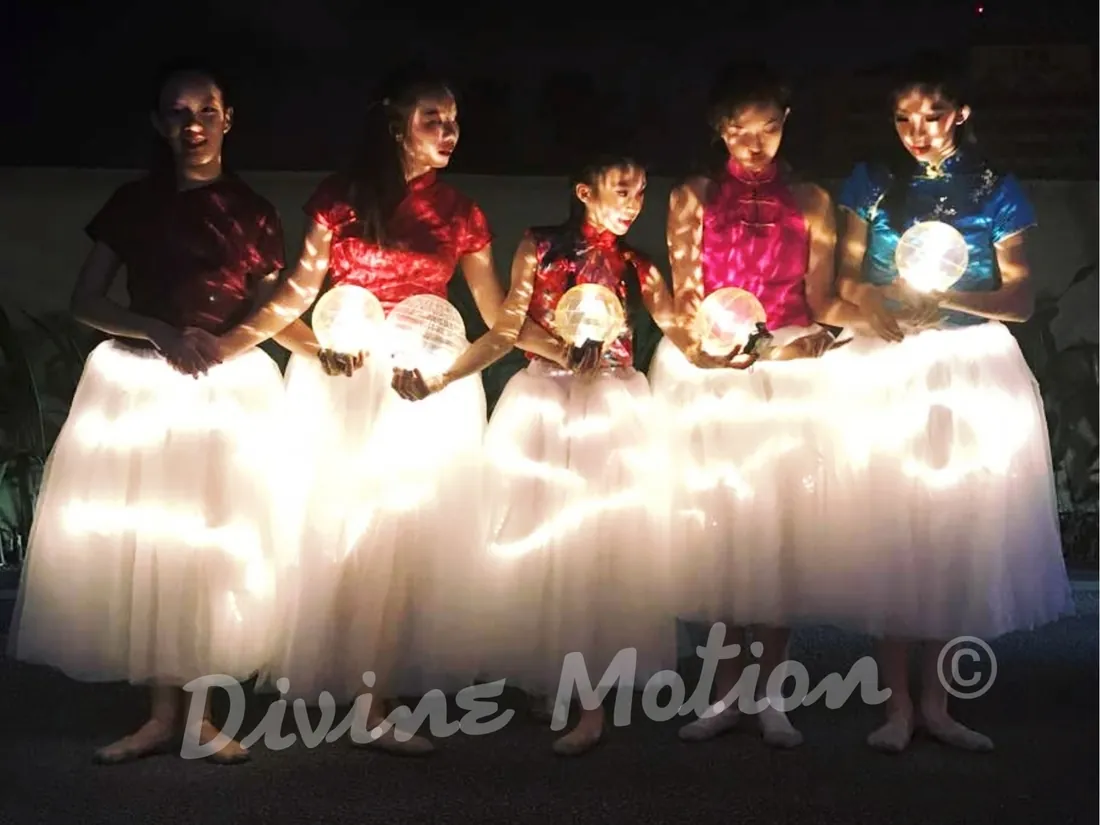 LED tutu dancers with light orbs